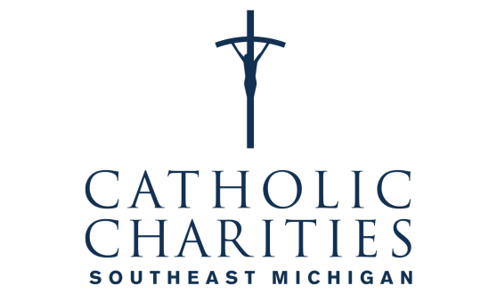 Dark blue image of a crucifix and text Catholic Charities Southeast Michigan