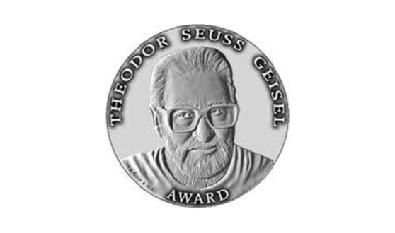 Silver stamp with a man's face and text Theodore Seuss Geisel Award