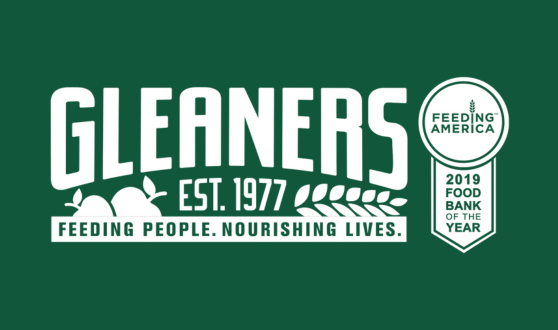 Dark green background with text Gleaners Est. 1977 Feeding People. Nourishing Lives and medal that reads Feeding America 2019 Food Bank of the Year
