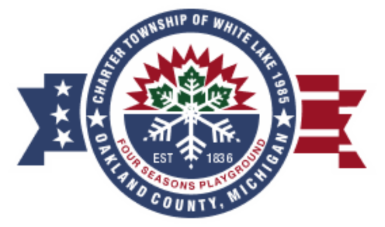 Dark blue circle with a sunrise, a green leaf, and a snowflake on a blue background with an American Flag in the background and text reading Four Seasons Playground Est. 1836 Charter Township of White Lake 1985 Oakland County Michigan